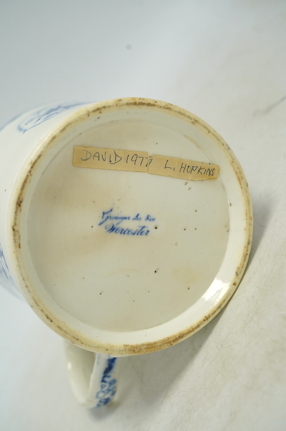 An early Victorian blue and white bone china mug, 13cm high. Condition - fair, crack to the handle